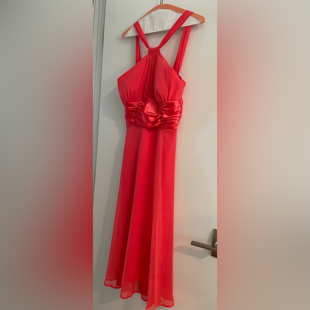 Beautiful coral maxi dress worn once and dry cleaned. This fits like size 6.
